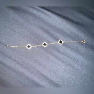 Elegant Gold and Black Clover Bracelet